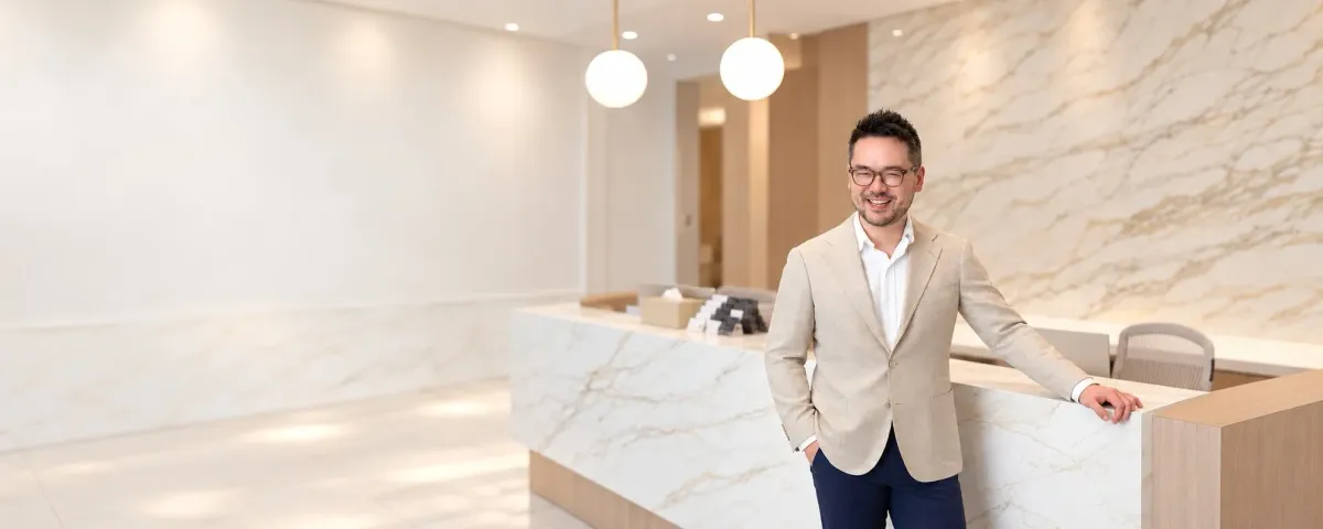 Dr. Danny Guo, cosmetic dermatologist and Mohs surgeon, at his Calgary clinic