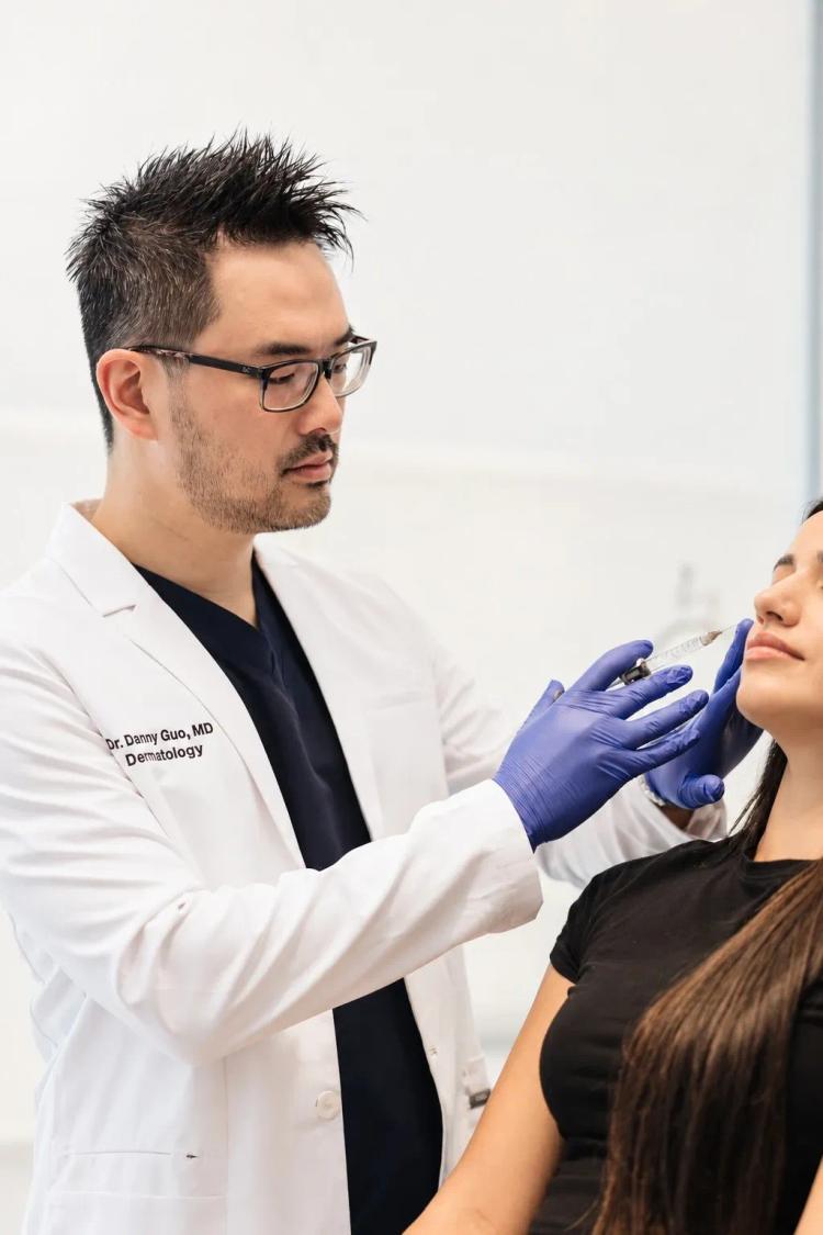 Dr. Danny Guo performing an injectable treatment